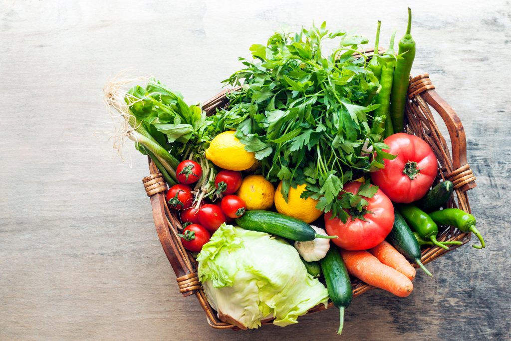 Vegetables,In,The,Basket,Organic,Vegetables,On,Wooden,Background
