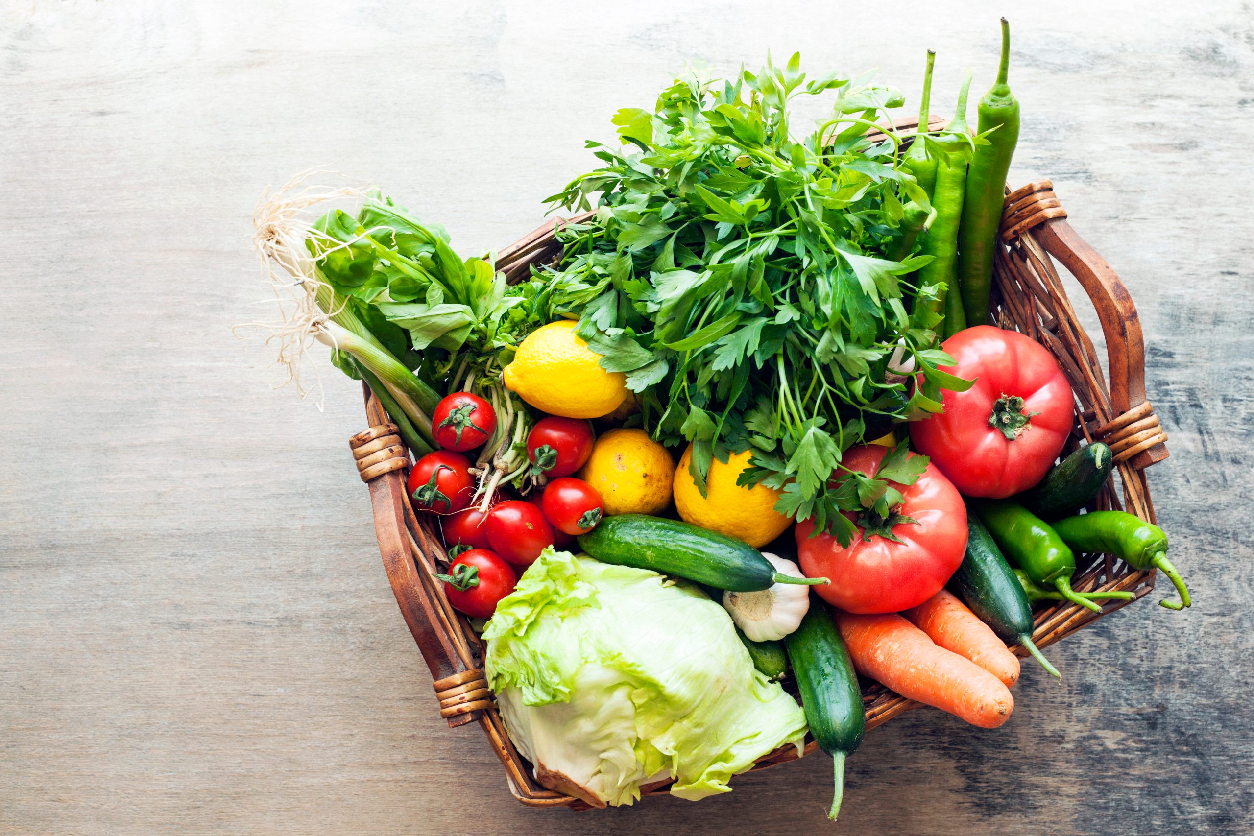Vegetables,In,The,Basket,Organic,Vegetables,On,Wooden,Background